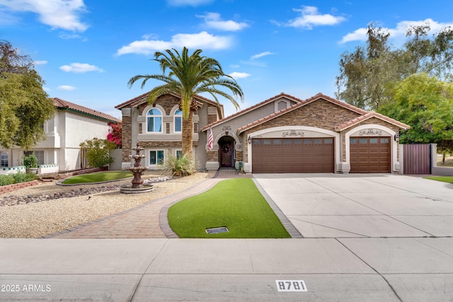 8781 S Mill Ave, Tempe, AZ 85284 - view of front of house featuring stucco siding, an attached garage, a tile roof, and driveway
