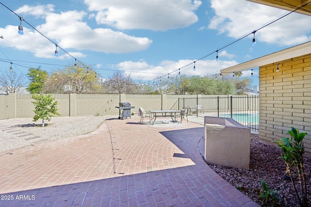 view of patio featuring a fenced backyard and area for grilling