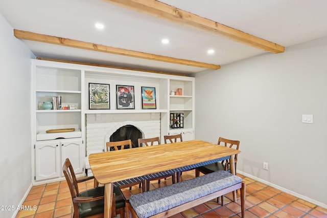 dining space featuring light tile patterned flooring, recessed lighting, baseboards, a brick fireplace, and beamed ceiling