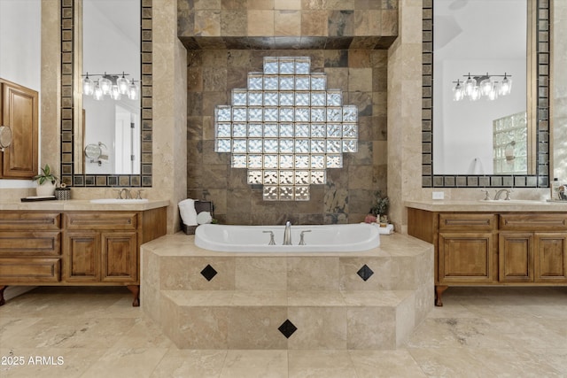 bathroom with vanity, tiled bath, and tile walls