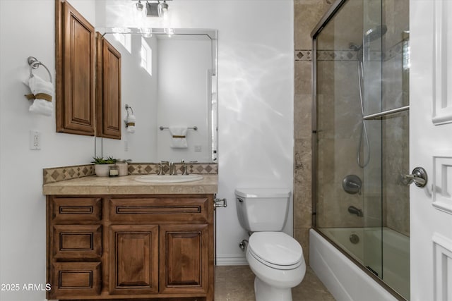 full bathroom featuring vanity, enclosed tub / shower combo, and toilet