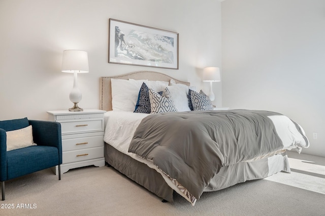 bedroom featuring light carpet