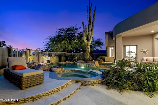 view of swimming pool featuring a patio area, a fenced backyard, a fenced in pool, and an in ground hot tub