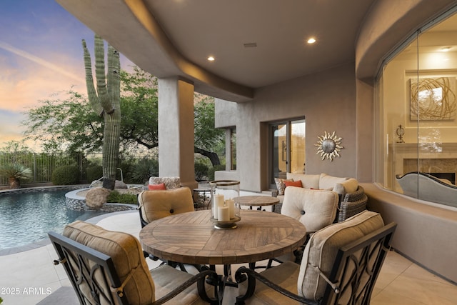 view of patio / terrace with fence and a fenced in pool