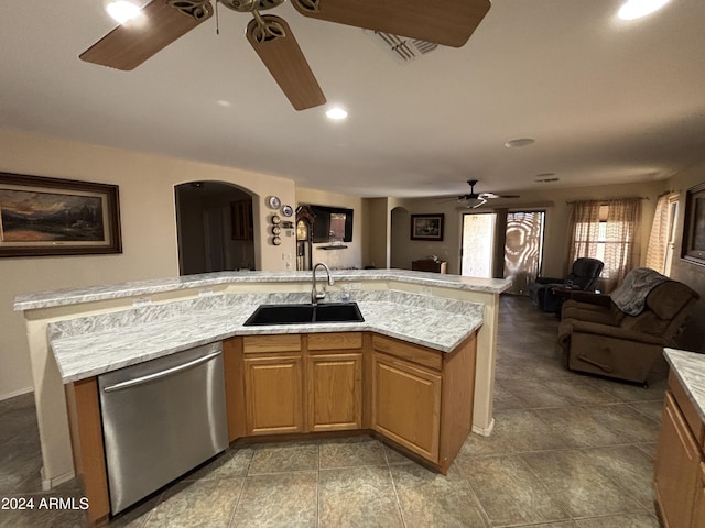 kitchen featuring ceiling fan, dishwasher, and sink