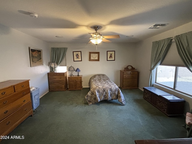 bedroom with ceiling fan and carpet floors