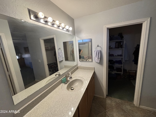 bathroom featuring tile patterned floors and vanity