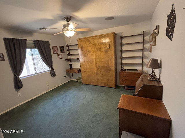 bedroom with ceiling fan and dark colored carpet