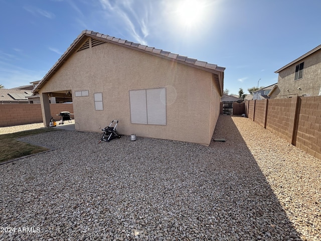 back of property featuring a patio area