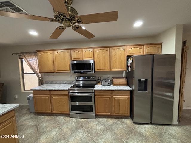 kitchen with ceiling fan and appliances with stainless steel finishes