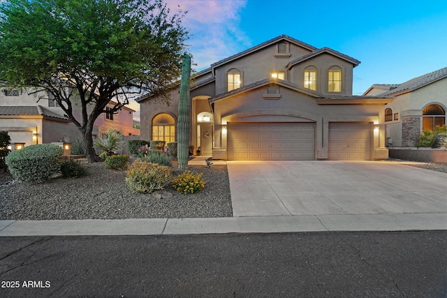 3859 N El Sereno St, Mesa, AZ 85207 - mediterranean / spanish-style home with concrete driveway, stucco siding, and an attached garage