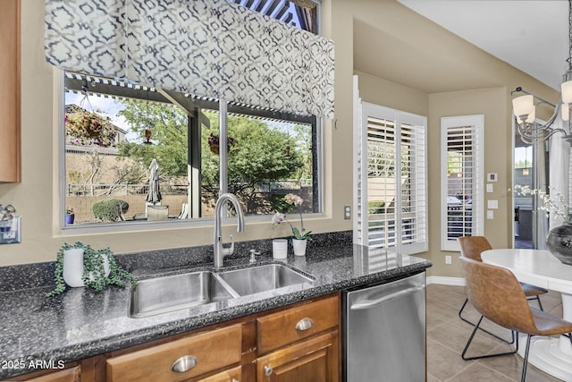 3859 N El Sereno St, Mesa, AZ 85207 - kitchen with dishwasher, a sink, brown cabinets, light tile patterned floors, and dark stone counters