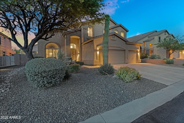 3859 N El Sereno St, Mesa, AZ 85207 - mediterranean / spanish-style house featuring stucco siding, driveway, and an attached garage