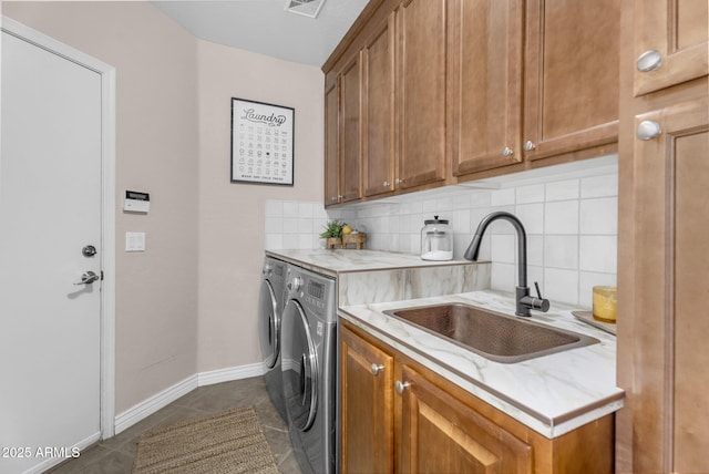 3859 N El Sereno St, Mesa, AZ 85207 - laundry room with independent washer and dryer, cabinet space, dark tile patterned floors, and baseboards