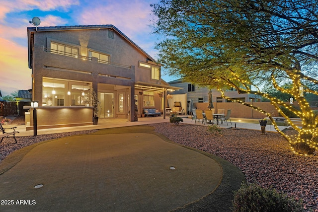 3859 N El Sereno St, Mesa, AZ 85207 - rear view of property featuring a patio area, stucco siding, and a putting area