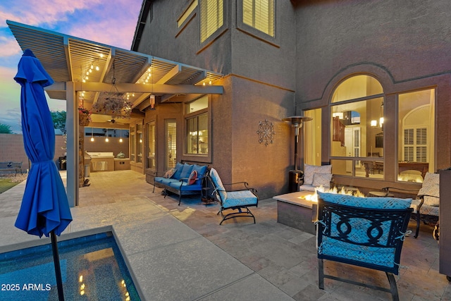3859 N El Sereno St, Mesa, AZ 85207 - patio terrace at dusk with a pergola, an outdoor living space with a fire pit, and a patio area