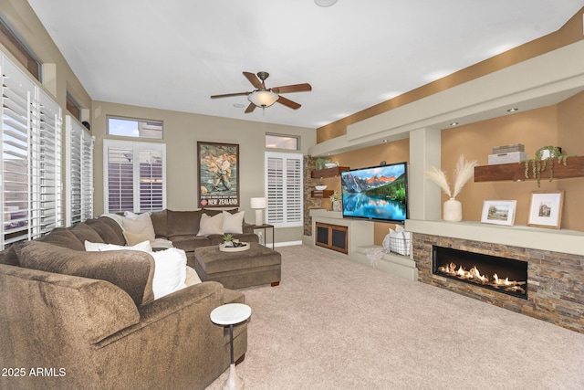 3859 N El Sereno St, Mesa, AZ 85207 - living room with carpet flooring, a ceiling fan, and a fireplace