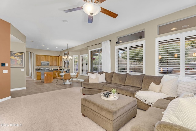 3859 N El Sereno St, Mesa, AZ 85207 - living area featuring ceiling fan, a chandelier, baseboards, and light colored carpet