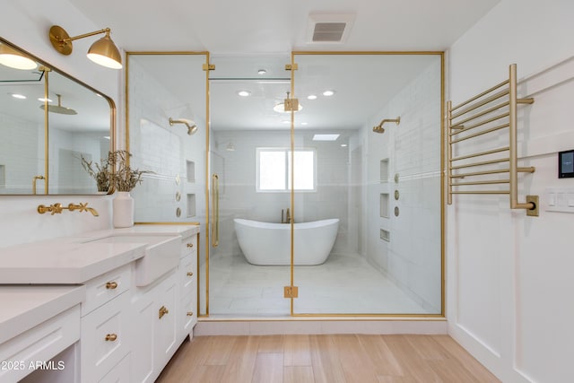 full bathroom featuring vanity and a stall shower