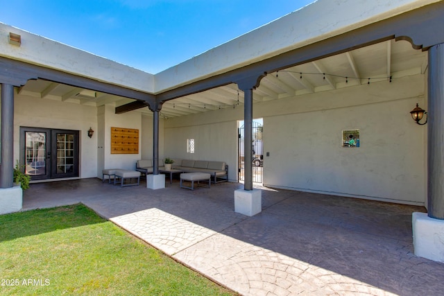 view of patio / terrace with an outdoor living space and french doors