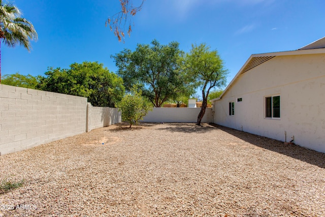 view of yard with a fenced backyard