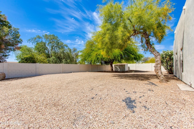 view of yard with a fenced backyard