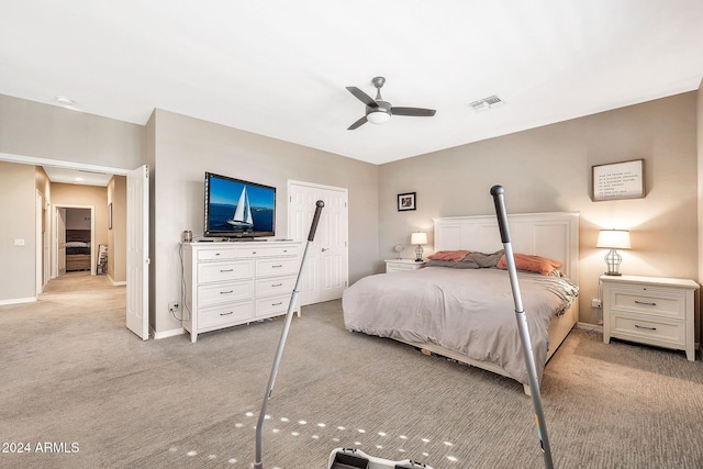 bedroom with ceiling fan and light carpet