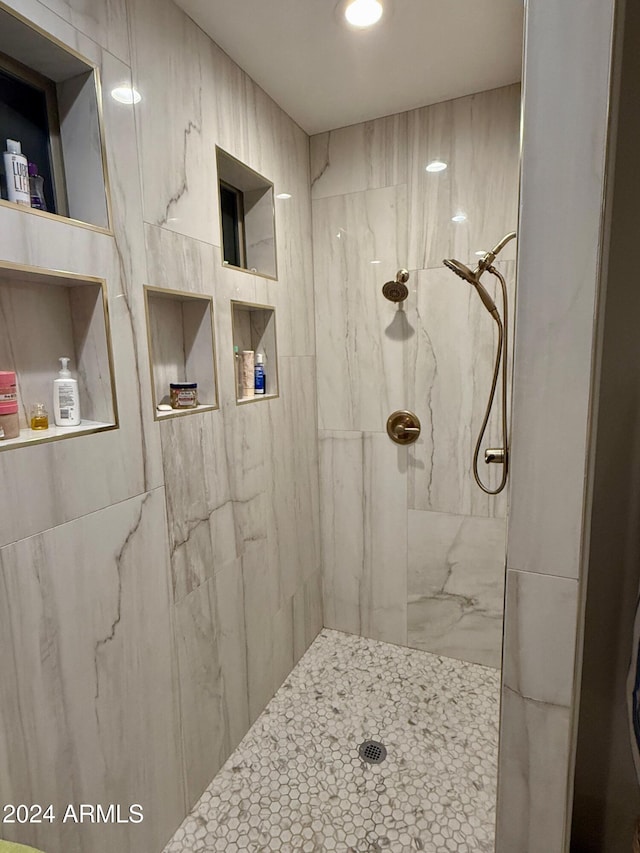 bathroom with tiled shower