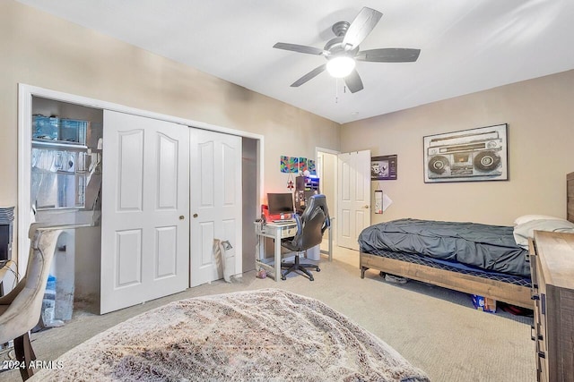 bedroom with light carpet, a closet, and ceiling fan