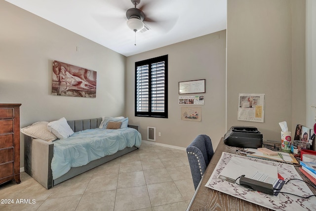 bedroom with ceiling fan and light tile patterned floors