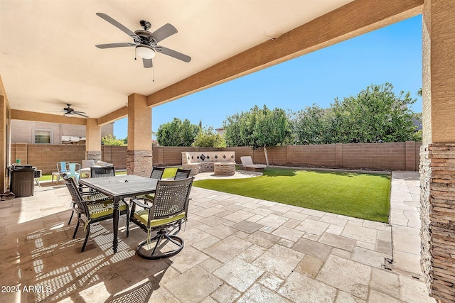 view of patio featuring an outdoor living space with a fire pit