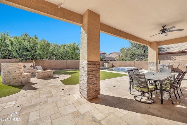 view of patio featuring ceiling fan