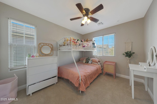 bedroom featuring carpet floors, baseboards, visible vents, and ceiling fan