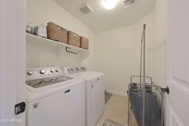 laundry area with light tile patterned floors, laundry area, visible vents, and separate washer and dryer