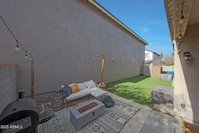 view of patio / terrace featuring an outdoor living space with a fire pit and fence