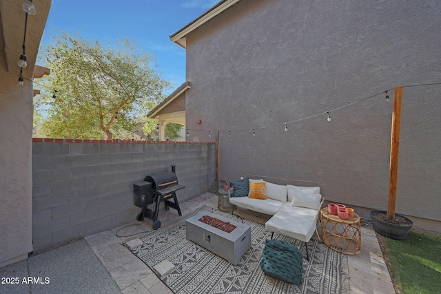 view of patio / terrace featuring an outdoor fire pit, grilling area, and a fenced backyard