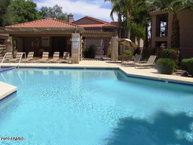 view of pool featuring a patio and a pergola