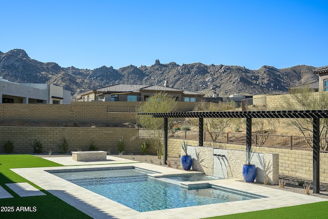 view of swimming pool featuring a mountain view, a patio, a fenced in pool, and a fenced backyard