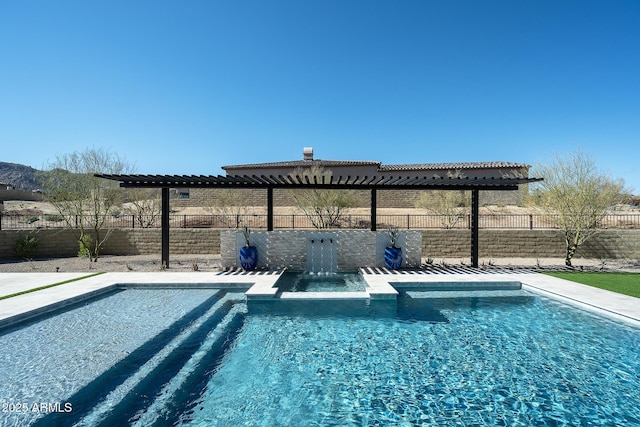 view of swimming pool with a pool with connected hot tub and a fenced backyard