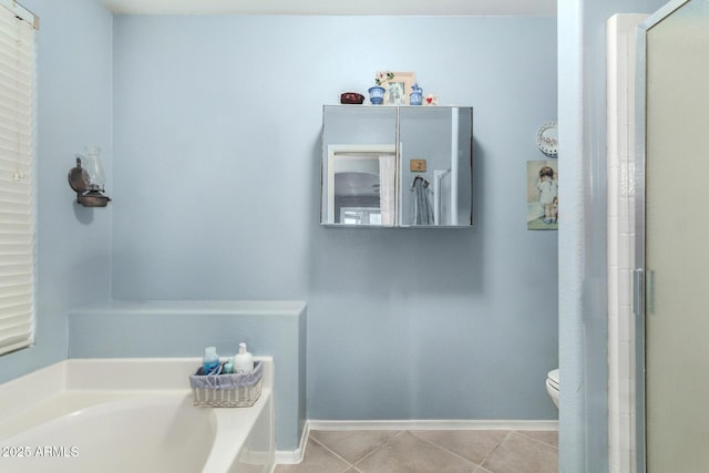 full bathroom featuring an enclosed shower, a garden tub, toilet, tile patterned flooring, and baseboards