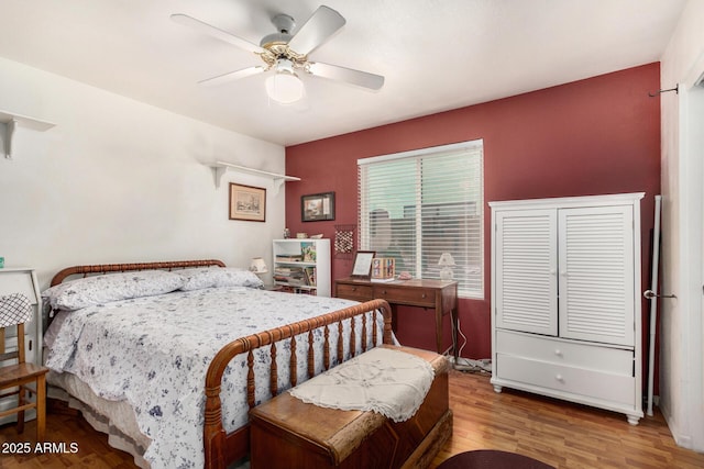 bedroom featuring ceiling fan and wood finished floors