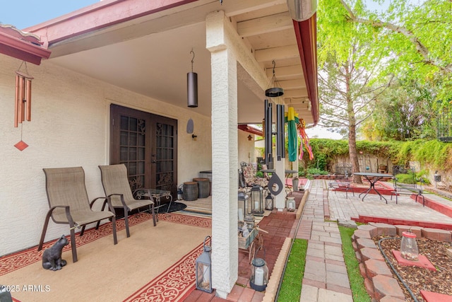 view of patio featuring french doors