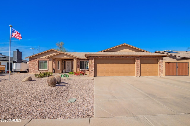 ranch-style house featuring concrete driveway, brick siding, and an attached garage