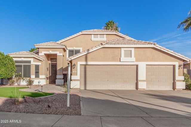 mediterranean / spanish-style house featuring a tile roof, driveway, an attached garage, and stucco siding