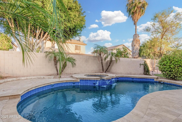 view of pool featuring a fenced backyard and a pool with connected hot tub