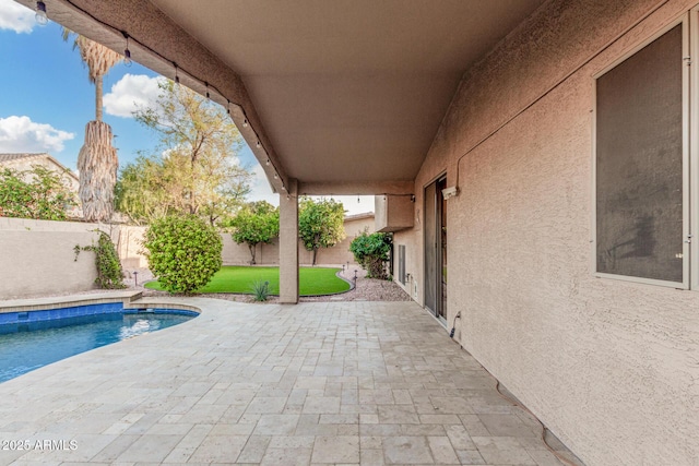 view of pool featuring a patio and a fenced backyard