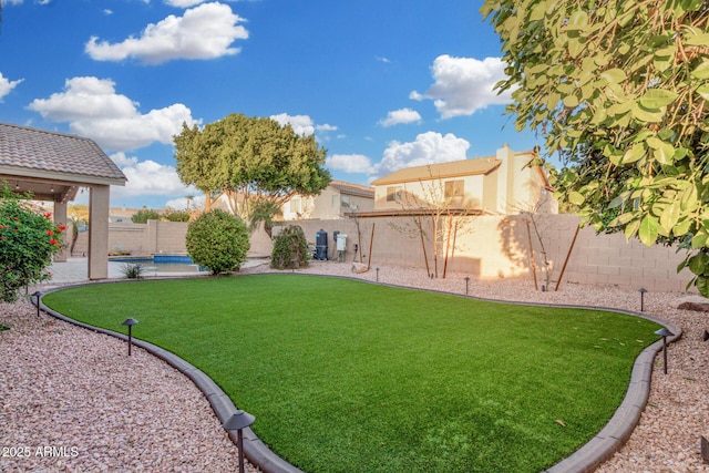 view of yard with a fenced backyard and a fenced in pool