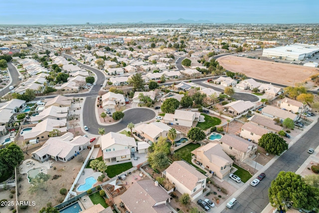 birds eye view of property with a residential view