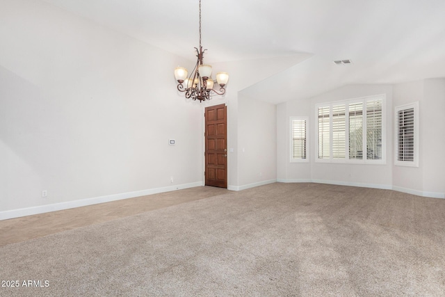 unfurnished room with lofted ceiling, baseboards, visible vents, and light colored carpet