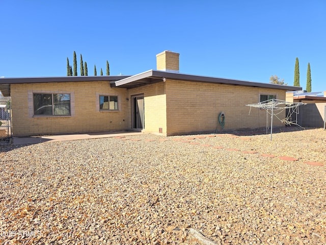 rear view of property featuring a patio